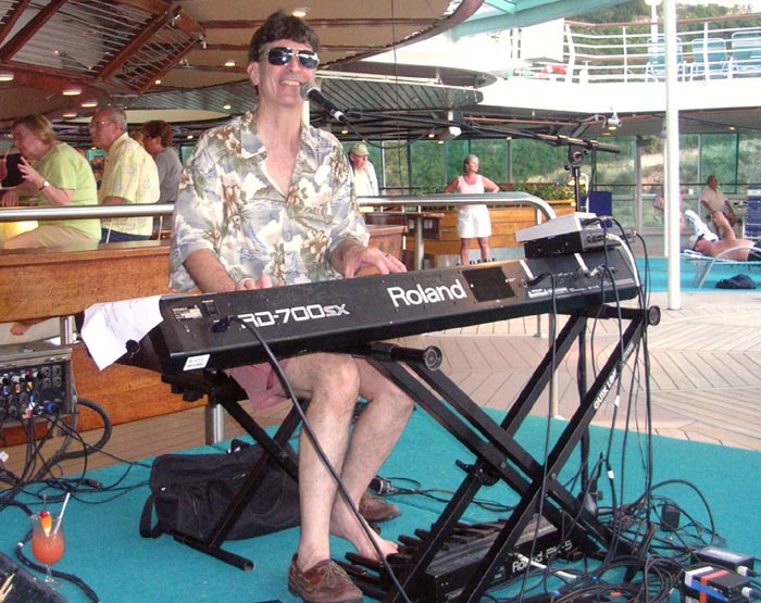 Don performing on the pool deck of the Grandeur